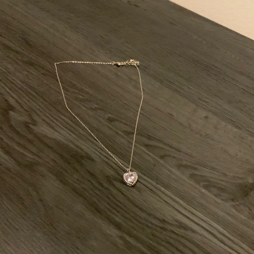 silver necklace with heart emblem